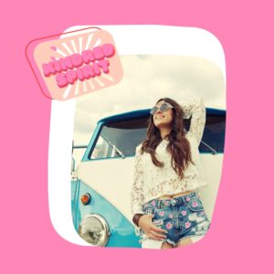 pink flower cut off jean shorts with hippie in front of a Volkswagen bus
