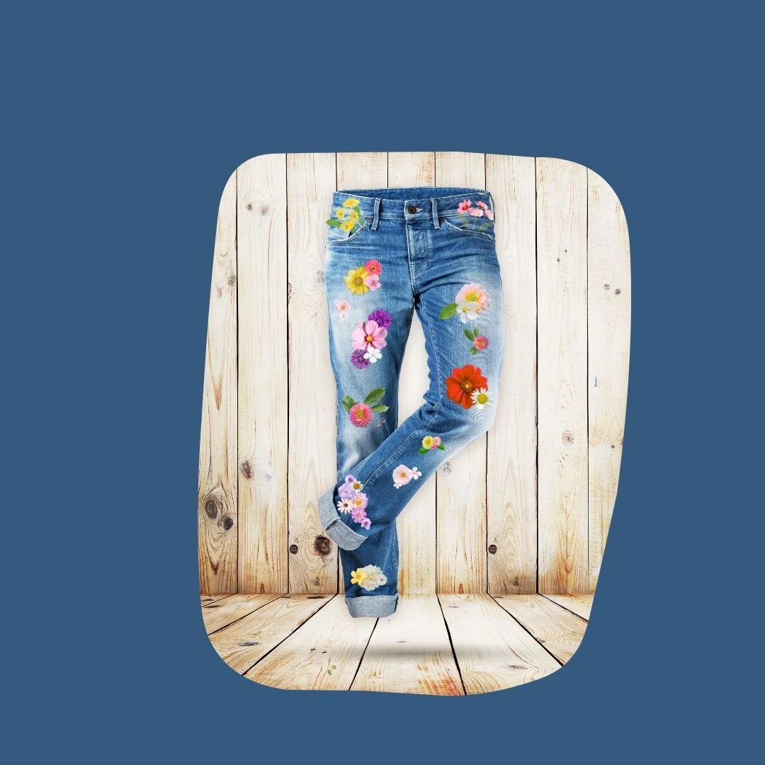 denim jeans with faux flower decals on them